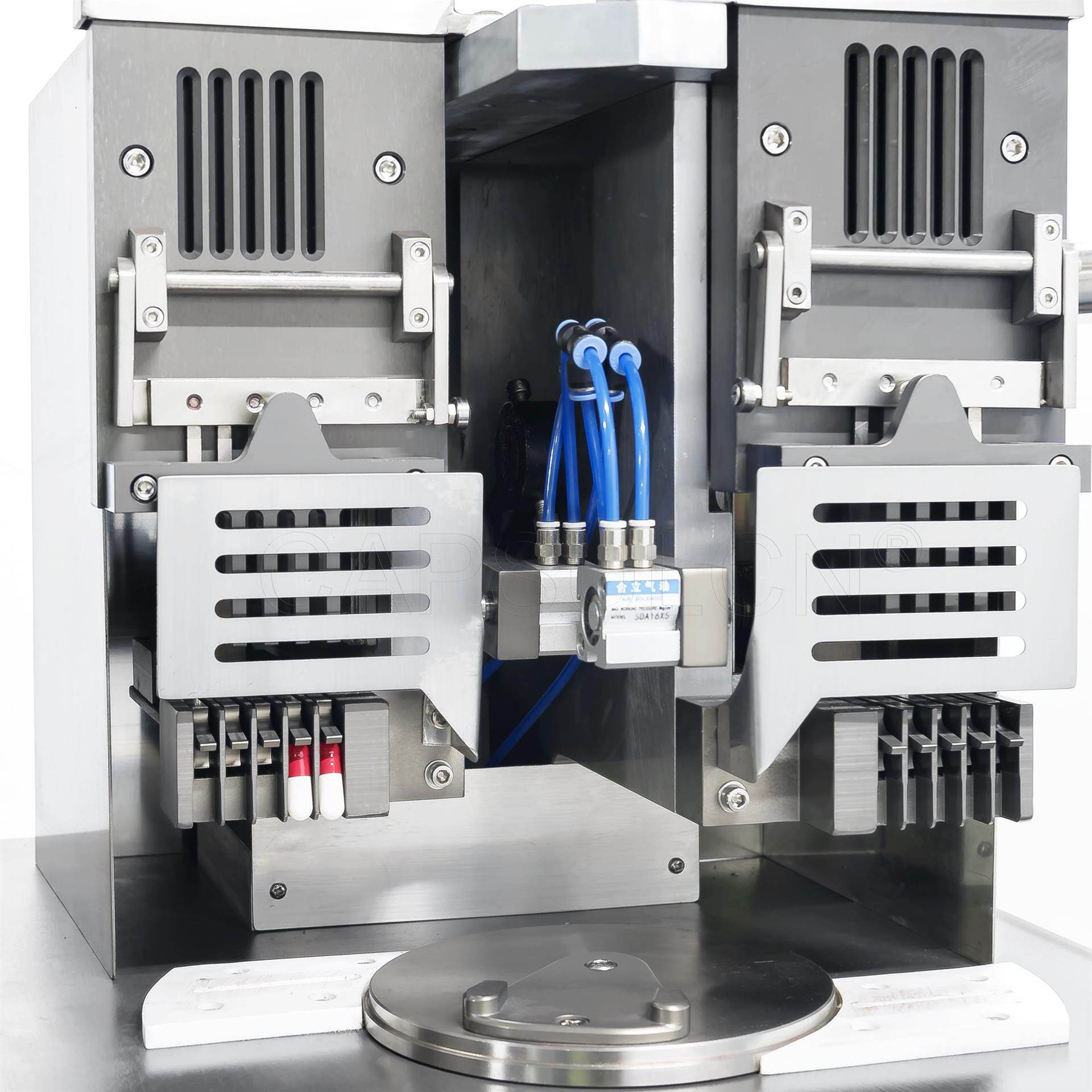 capsule sowing mechanism for auto capsule fillers